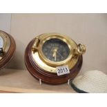 An Almadia brass ship's clock.