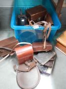 A box of leather camera cases, collar boxes etc.,