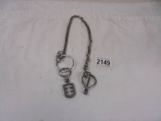 A corkscrew/bottle opener on long chain.