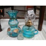 A Victorian blue glass hand oil lamp.