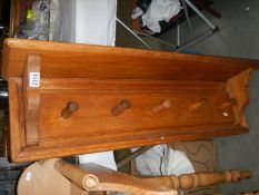 A mid 20th century pine wall coat rack, COLLECT ONLY.