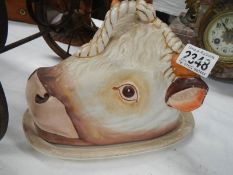 A ceramic butter dish in the form of a cow.