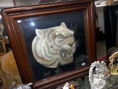 A mahogany embroidered tiger head fire screen, COLLECT ONLY.