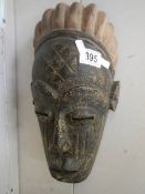 An African mask, possibly Congo, 32 x 14 cm.