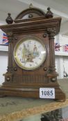 An Edwardian mantel clock with rare shoe shine automation/automata face, in working order. 33.5 cm