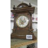 An Edwardian mantel clock with rare shoe shine automation/automata face, in working order. 33.5 cm