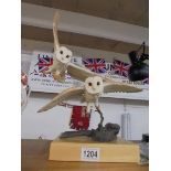 A Country Artists figure of two barn owls.
