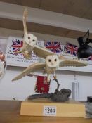 A Country Artists figure of two barn owls.