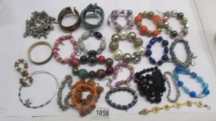 22 assorted bracelets including some in the style of Pandora.