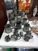 A quantity of pewter including beer mugs etc.