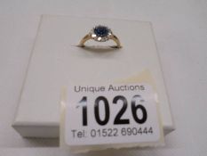 A yellow gold blue and white diamond ring, size O half, 2.4 grams.