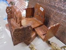 A teak box and three extending book racks.