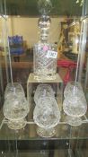 A Royal Albert crystal decanter and six cut glass brandy goblets.