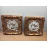 2 gilt framed classical resin plaques of children (28cm x 28cm)