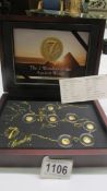 A cased set of gold coins 'The Seven Wonders of the Ancient World'