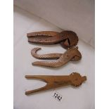 Three vintage wooden nut crackers.