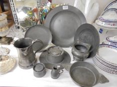 Nine pieces of old pewter including trays, inkwell etc.,