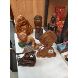 A quantity of interesting wooden figures including some African & Buddha etc.