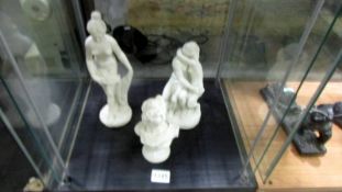 Two classical style figures and a bust.
