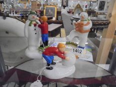 Three Coalport 'The Snowman' figures - Dancing With Teddy, Adding a Smile & Building a snowman