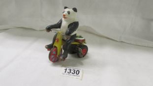 A bike riding bear mechanical toy, working.