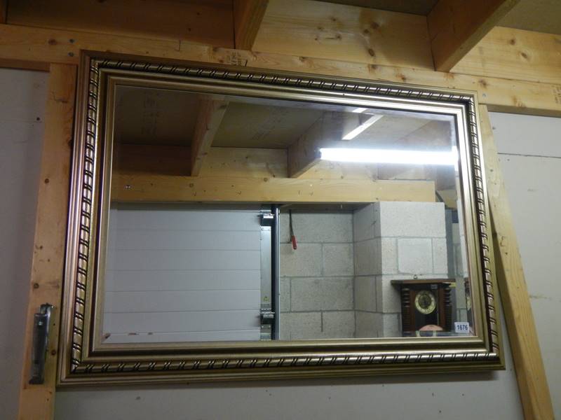 A gilt framed bevel edged mirror. COLLECT ONLY.
