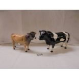 Two Beswick bulls.