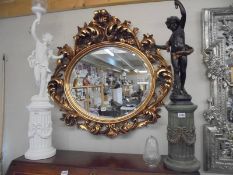 A good quality oval bevel edged mirror in gilded frame. COLLECT ONLY.