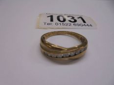 A yellow gold 12 stone diamond ring, size O half, 1.8 grams.