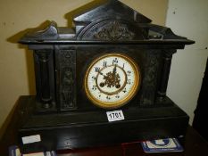 An old style mantel clock, springs ok.