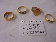 A 22ct gold ring 1.9g, an 18ct gold ring 4g, a 9ct gold ring 2.85g and an unmarked ring.