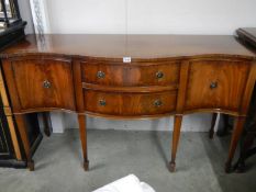 A good mahogany serpentine front sideboard in good condition, COLLECT ONLY.