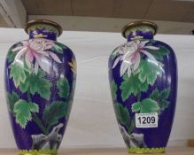 A pair of blue floral Cloissonne' vases.