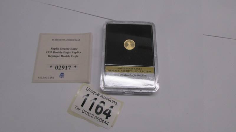 A 1933 Double Eagle gold (585) replica coin, 0.5 grams.