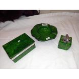 A green Onyx smokers kit. Lighter, ashtray and cigarette case.