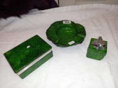 A green Onyx smokers kit. Lighter, ashtray and cigarette case.