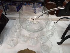 A punch bowl, ladle & 11 glasses/cups