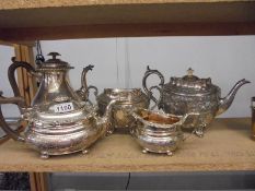 Two silver plate teapots and a sugar bowl, milk jug and water jug.