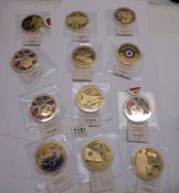 Nine R.A.F commemorative coins and three WW2 examples.