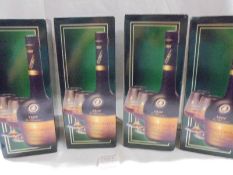 Four boxed bottles of Courvoisseur VSOP cognac.