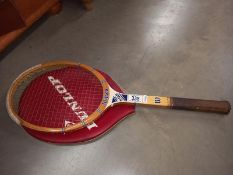A vintage Wilson Future Star tennis racket with Dunlop cover