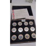 A cased complete set of gold plated with colour tableau 'British Military Aircraft' coins with cert.