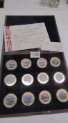 A cased complete set of gold plated with colour tableau 'British Military Aircraft' coins with cert.