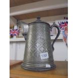 A large antique pewter lidded jug.