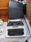 A Silver reed portable/cased typewriter COLLECT ONLY