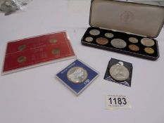 A cased set of pre-decimal coins, a set of four farthings, a 1980 crown and a Marie Therese coin.