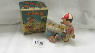 A mechanical ice cream seller toy, working, made in China.