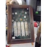 A 1930's onwards display cabinet of Lincolnshire Horticultural and Gardening medals and ribbons.