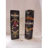 Two bottles of Glenfiddich pure malt whisky.