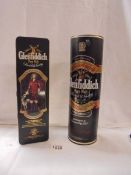 Two bottles of Glenfiddich pure malt whisky.
